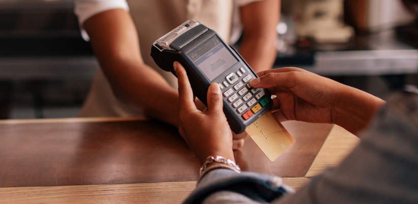 a person paying with a debit/credit card